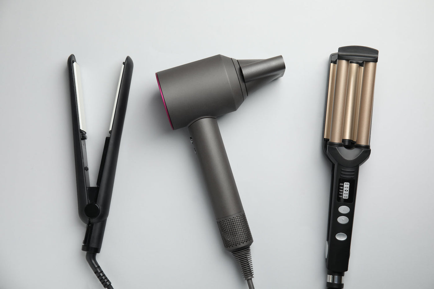 Variety of luxury hot hair tools displayed as a trio