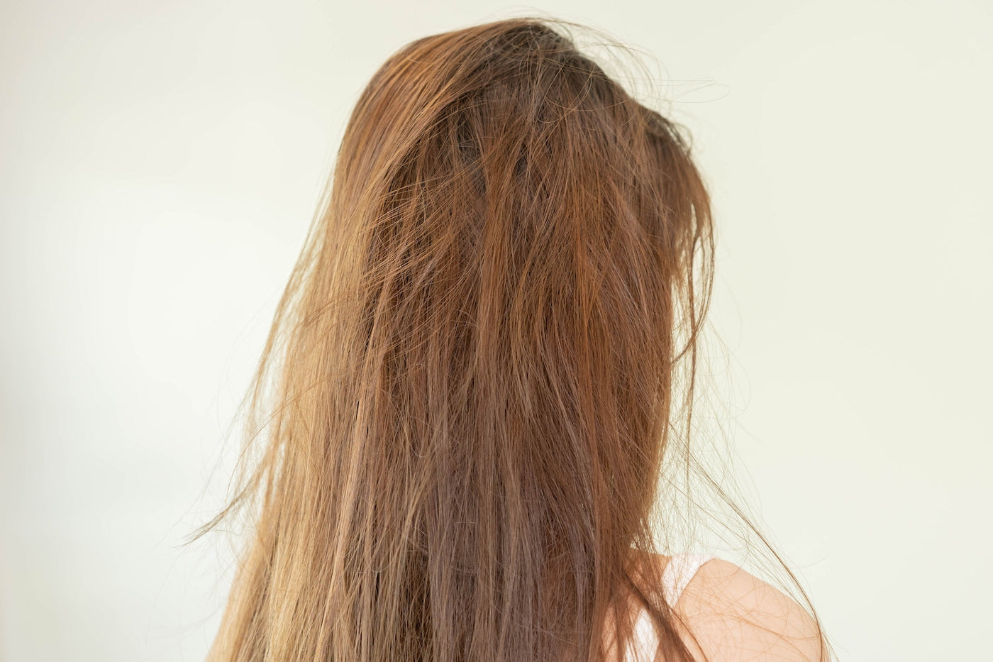 Woman with long, extremely damaged and dull hair