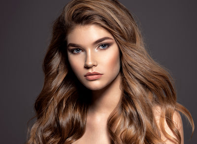 Young brown-haired woman with long curly hair