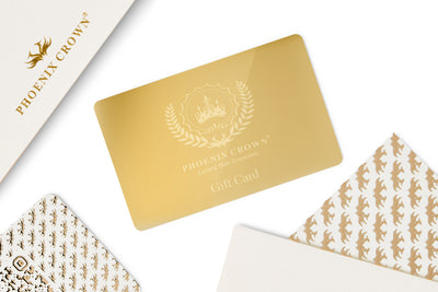 Phoenix Crown Metal Gift Card  displayed out of its luxury gift box showcasing its elegant design and shine, including the Phoenix Crown logo