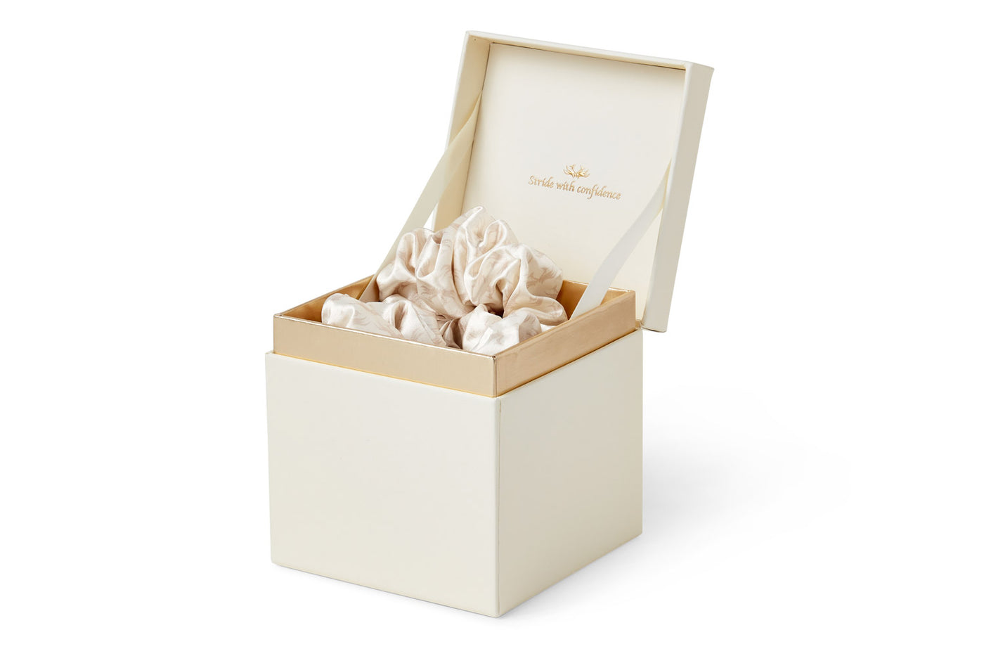 A side view of Phoenix Crown Satin Scrunchie Trio displayed in their luxurious box with tagline